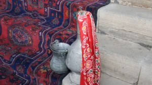 Professional carpet cleaner washing an oriental rug with a rotary buffer machine