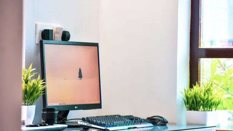 Messy corporate office desks with full bins and dusty screens before cleaning