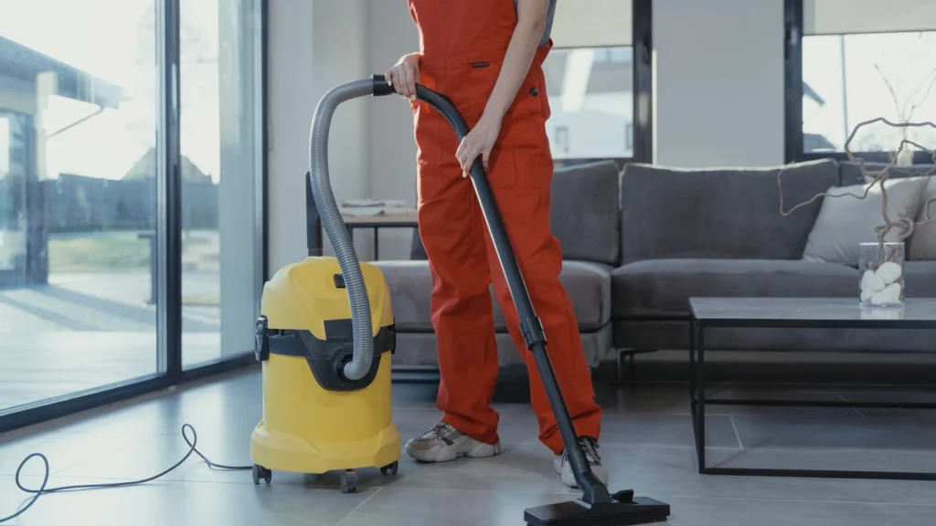 Professional villa cleaners dusting and polishing a luxury villa staircase in Dubai
