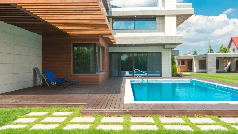 Clean villa patio with spotless stone tiles and shining sliding glass doors after cleaning